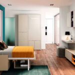 Cama abatible con sofá delante