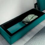 Detalle sofá arcón de cama abatible
